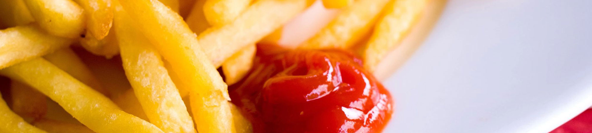 Close-up of ketchup on French fries.