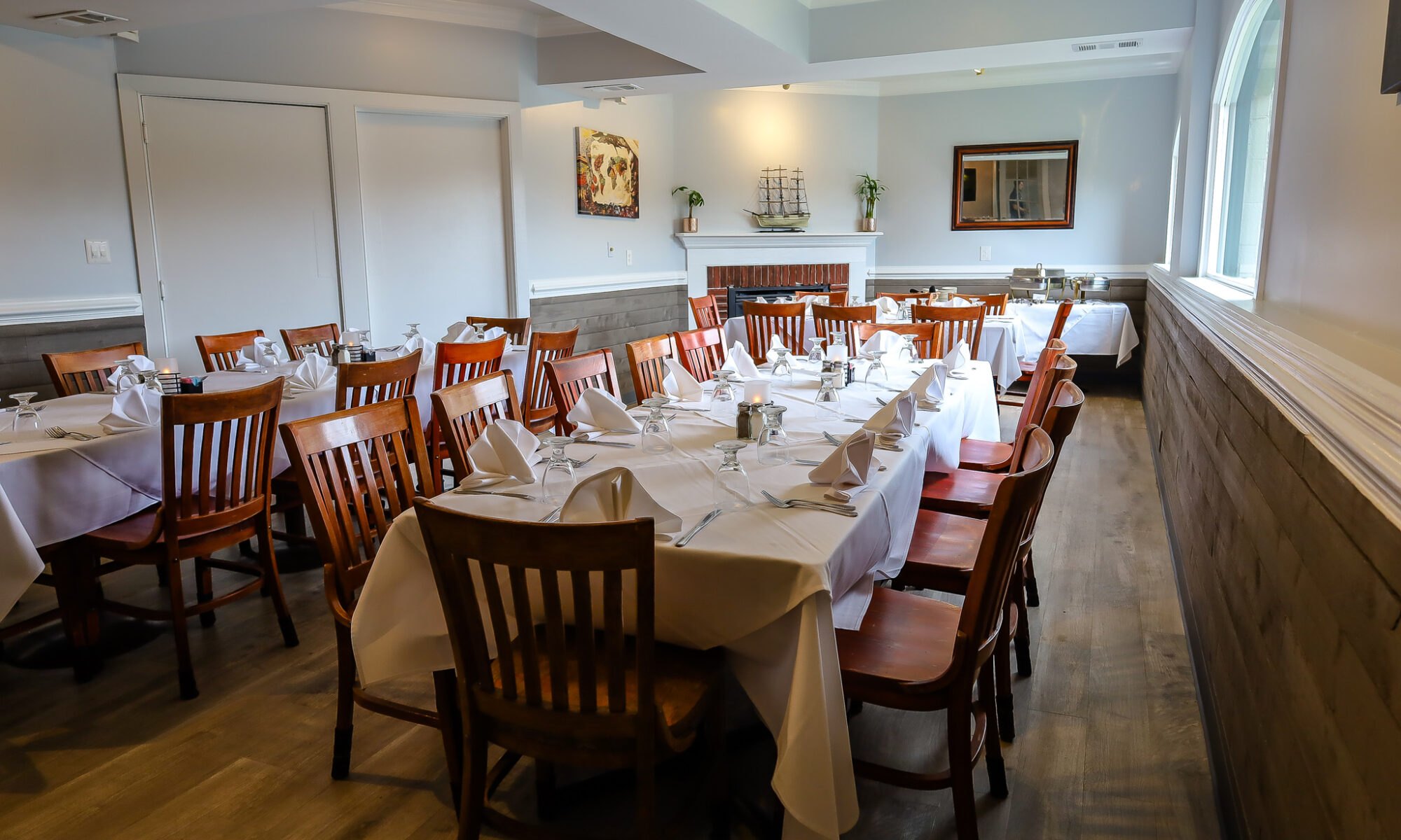 Elegant dining room with neatly set tables.
